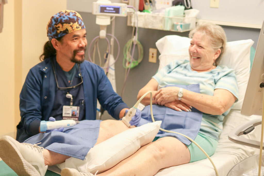 Our anesthesiologist, Vinny, and an individual receiving iovera treatment.